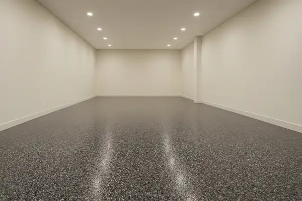Rendered preview of a flake epoxy commercial shop floor in the Tuxedo blend