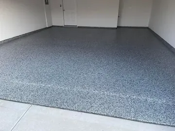 Black-and-white flake epoxy in a two-car garage — a Greater Cincinnati job