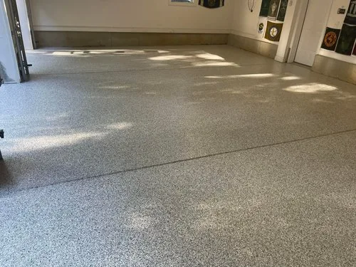 Gray flake epoxy floor in a three-car garage, a Greater Cincinnati job