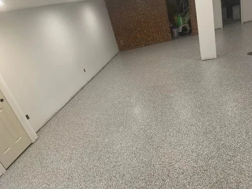 Grey flake epoxy floor in a finished basement &mdash; a Greater Cincinnati job