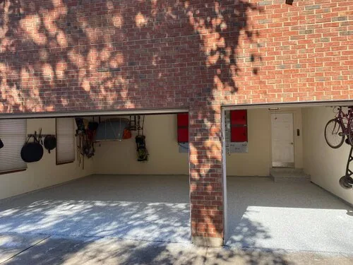 Flake epoxy garage floor beside a brick column &mdash; a Greater Cincinnati job