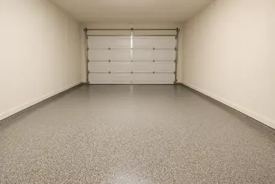 Two-car garage render with a speckled granite-look finish