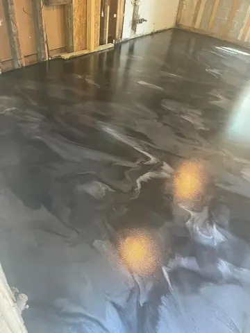 Metallic epoxy floor in a basement hallway — a Greater Cincinnati job