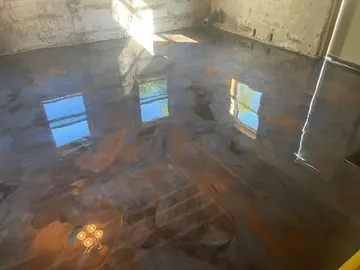 Swirled metallic epoxy in a basement room — a Greater Cincinnati job