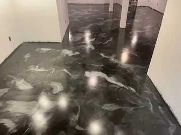 Black and silver metallic epoxy in a room with stairs — a Greater Cincinnati job
