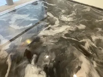 Black-and-white metallic epoxy with soft reflections — a Greater Cincinnati job