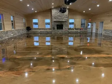 Brown and copper metallic epoxy in a large timber-framed room — a Greater Cincinnati job