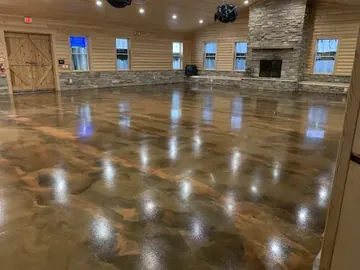 Brown metallic epoxy reflecting the lights of a large room — a Greater Cincinnati job