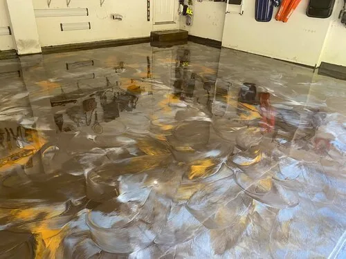Grey and gold metallic epoxy floor in a garage &mdash; a Greater Cincinnati job