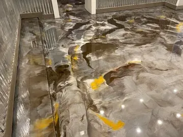 Silver and gold metallic epoxy in a shop with metal walls — a Greater Cincinnati job