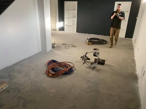 Nick photographing a basement slab before the prep starts