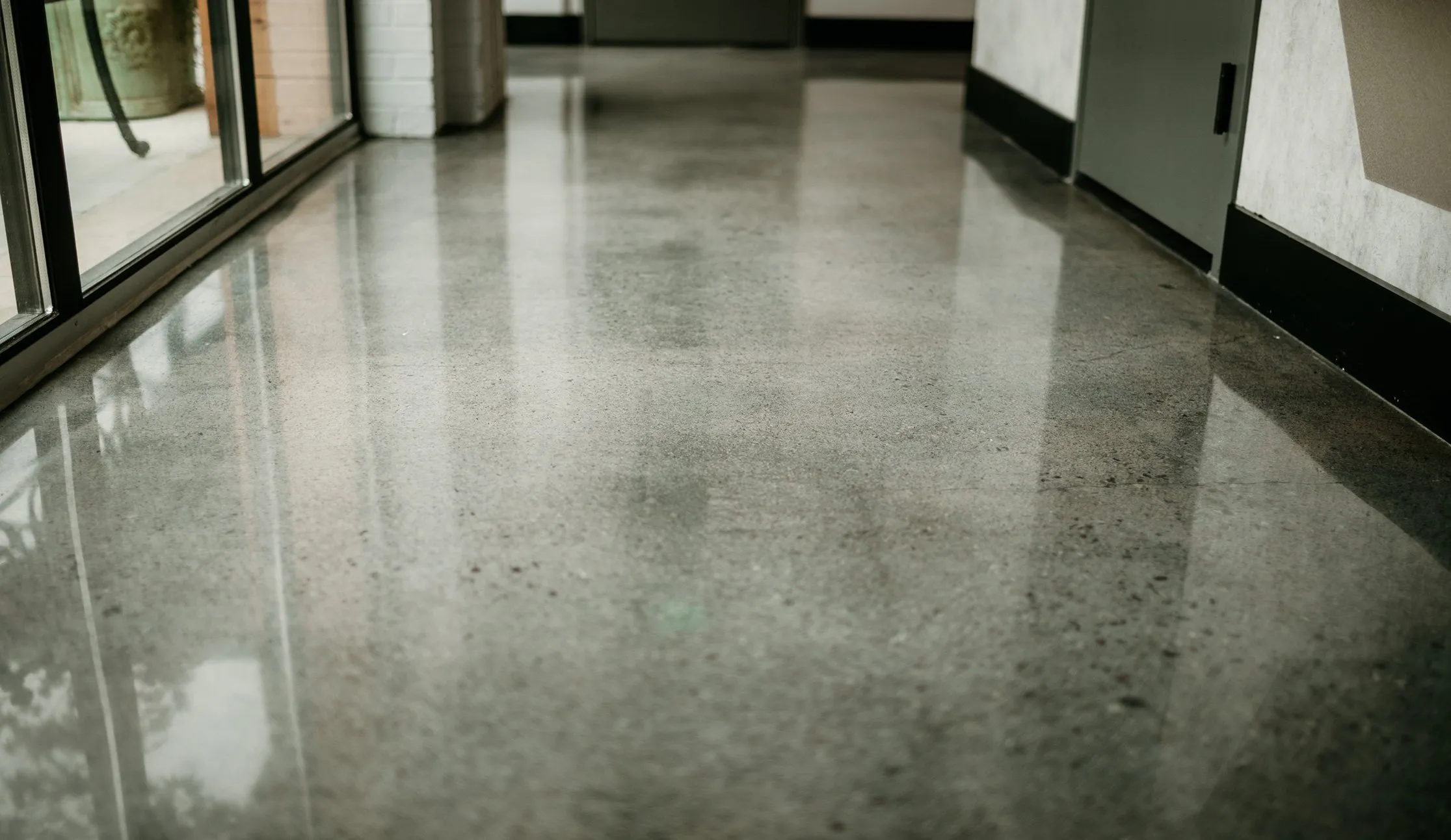 Hallway with a clear gloss finish over gray concrete in Erlanger, KY