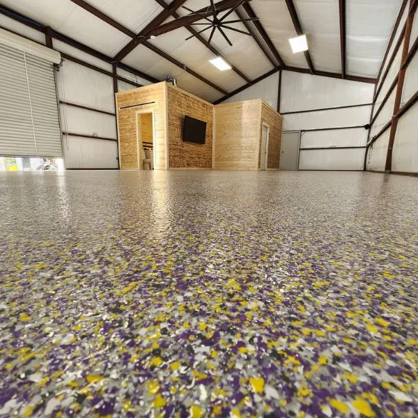 Shop garage with purple and gold flake epoxy floor in Newport, KY