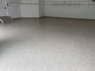 White glossy epoxy floor in an open commercial room — a Greater Cincinnati job